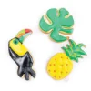 3 emporte-pièces dorés toucan/ananas/feuille